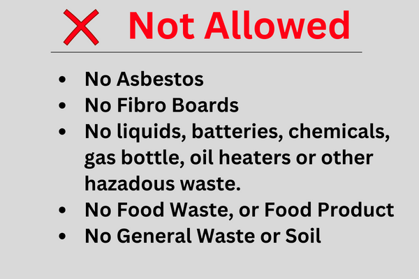 Image of a sign indicating types of concrete waste material that is not allowed.